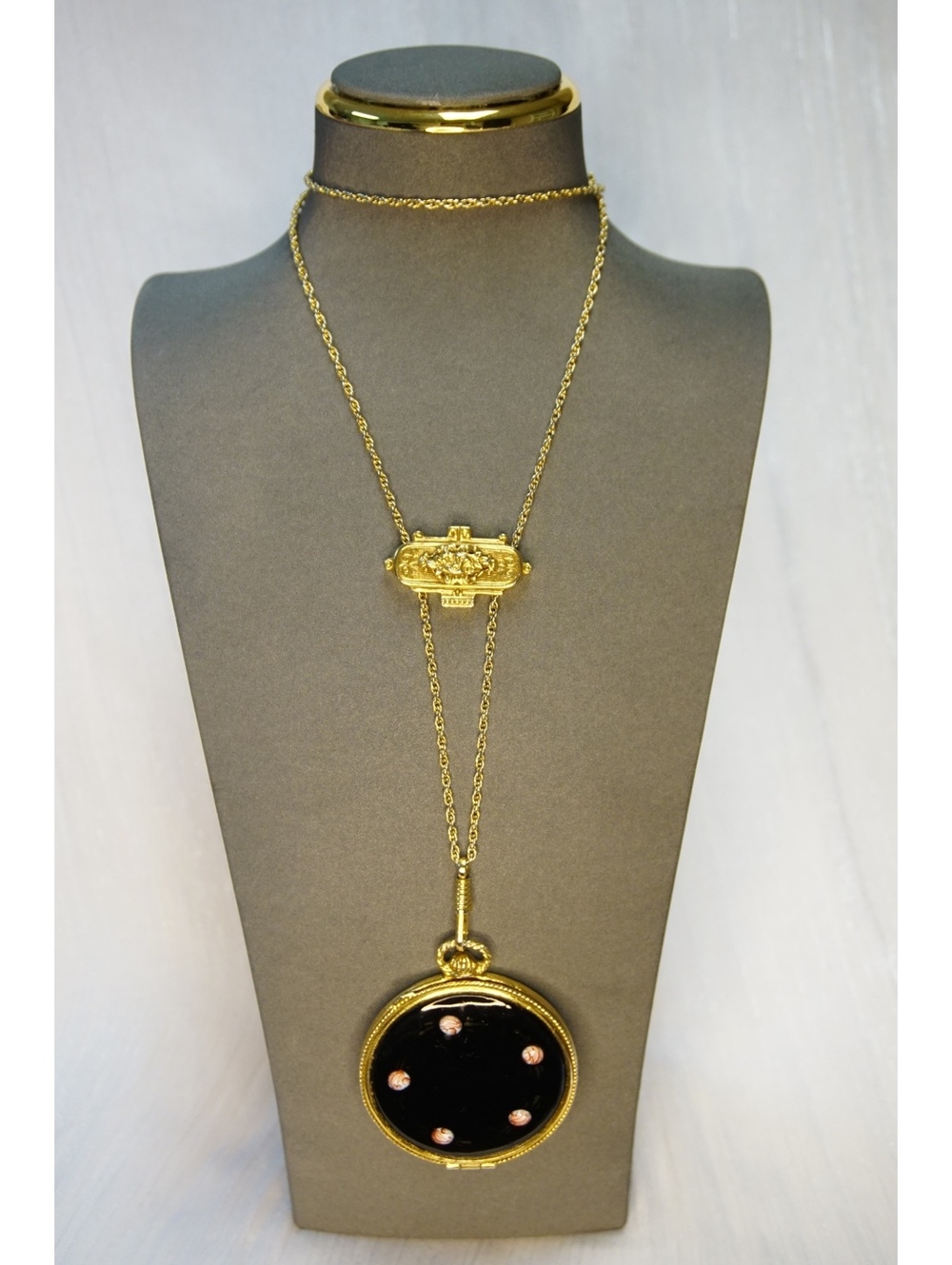 Gold tone black round pendant necklace